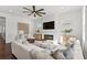Bright living room with a fireplace, large windows, and comfortable seating offering a relaxing atmosphere at 509 Buckingham E Ave, Oldsmar, FL 34677