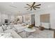 Open-concept living area with stylish decor, modern lighting, and a seamless flow to the kitchen at 509 Buckingham E Ave, Oldsmar, FL 34677