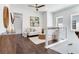 Upstairs loft features hardwood floors, neutral paint, lots of natural light, and modern railing at 509 Buckingham E Ave, Oldsmar, FL 34677