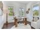 Cozy office with hardwood floors, white walls, and natural light, featuring a stylish desk and decor at 509 Buckingham E Ave, Oldsmar, FL 34677