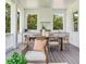 Covered patio features dining table, outdoor kitchen, and seating, perfect for entertaining at 509 Buckingham E Ave, Oldsmar, FL 34677