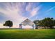 The waterfront park features an outdoor stage with artwork and views of a tranquil bay at 509 Buckingham E Ave, Oldsmar, FL 34677