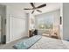 Cozy bedroom featuring a ceiling fan, a double closet and natural light from a window at 513 Harbor Springs Dr, Palm Harbor, FL 34683