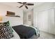 This bedroom features a ceiling fan, a unique bed frame, and soft decor at 513 Harbor Springs Dr, Palm Harbor, FL 34683