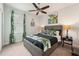 This bedroom features a ceiling fan, a unique bed frame, and soft decor at 513 Harbor Springs Dr, Palm Harbor, FL 34683