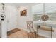 Bright foyer featuring stylish decor, light wood-look tile flooring and large window at 513 Harbor Springs Dr, Palm Harbor, FL 34683