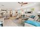 Open-concept living room adjacent to dining room with comfortable seating and plenty of natural light at 513 Harbor Springs Dr, Palm Harbor, FL 34683