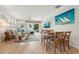 Open-concept living room and dining area with comfortable seating, stylish decor, and easy access to the outdoor patio at 513 Harbor Springs Dr, Palm Harbor, FL 34683