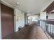 Exterior hallway with elevator access and views of manicured greenery at 5157 Silent Loop # 301, New Port Richey, FL 34652