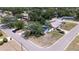 Aerial view of the property, situated on a corner lot with mature trees and lush greenery at 5698 26Th N Ave, St Petersburg, FL 33710