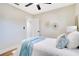 Cozy bedroom features wood floor, ceiling fan, and light walls at 5698 26Th N Ave, St Petersburg, FL 33710