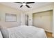 Bedroom with closet includes ceiling fan, light walls, and wood floor at 5698 26Th N Ave, St Petersburg, FL 33710