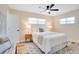 Cozy bedroom with a ceiling fan, neutral walls, and a comfortable queen bed at 5698 26Th N Ave, St Petersburg, FL 33710