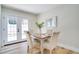 Cozy dining area featuring french doors, seating for four, and stylish decor at 5698 26Th N Ave, St Petersburg, FL 33710