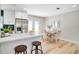 Modern kitchen with stainless steel appliances, quartz countertops, and seamless access to dining area at 5698 26Th N Ave, St Petersburg, FL 33710
