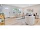 Bright living room featuring hardwood floors and an open layout, creating a welcoming atmosphere at 5698 26Th N Ave, St Petersburg, FL 33710