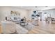 Bright and airy living room with hardwood floors, modern furnishings, and an open-concept design at 5698 26Th N Ave, St Petersburg, FL 33710