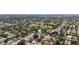 Aerial view of a lush residential neighborhood with mature trees, homes, and a nearby park at 5698 26Th N Ave, St Petersburg, FL 33710