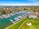 Overhead view of a marina, pool, golf course, and homes with stunning waterfront and golf course views at 5964 Bayview S Cir, St Petersburg, FL 33707