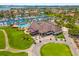 Aerial view showcasing the clubhouse, pool, golf course, and marina in a beautiful coastal community at 5964 Bayview S Cir, St Petersburg, FL 33707