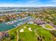 Beautiful aerial shot highlighting the marina, golf course, pool, clubhouse, and waterfront community at 5964 Bayview S Cir, St Petersburg, FL 33707