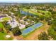 Stunning aerial view of the tennis courts, golf course, and surrounding community amenities at 5964 Bayview S Cir, St Petersburg, FL 33707
