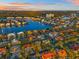 Breathtaking aerial view of waterfront homes surrounded by canals, lush greenery, and beautiful blue waters at 5964 Bayview S Cir, St Petersburg, FL 33707