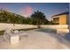 An inviting backyard featuring a serene pool with stone pavers and stylish lounge chairs at 5964 Bayview S Cir, St Petersburg, FL 33707