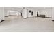 Spacious basement featuring epoxy floors, white walls, and pillars for a modern and clean look at 5964 Bayview S Cir, St Petersburg, FL 33707