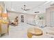 Bright hallway featuring modern furniture, white floor, and modern lighting fixtures throughout at 5964 Bayview S Cir, St Petersburg, FL 33707