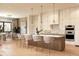 Bright kitchen featuring a large island with seating, modern appliances, and sleek cabinetry at 5964 Bayview S Cir, St Petersburg, FL 33707