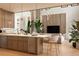 Open-concept kitchen and living area with a large island and modern design elements at 5964 Bayview S Cir, St Petersburg, FL 33707