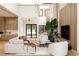 Bright, open living space with hardwood floors, modern furniture, and a view of the staircase at 5964 Bayview S Cir, St Petersburg, FL 33707