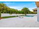 Relax poolside on this spacious patio with a well-maintained lawn and tropical landscaping at 5964 Bayview S Cir, St Petersburg, FL 33707