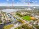 Aerial view of a neighborhood near Howard Park Beach with water access and a baseball field at 600 Banana St, Tarpon Springs, FL 34689