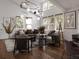 Bright and airy living room with modern furniture, lots of natural light, and hardwood floors at 600 Banana St, Tarpon Springs, FL 34689