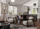 Open-concept living room with dining area and a view into the kitchen with modern decor at 600 Banana St, Tarpon Springs, FL 34689