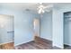 Bedroom view featuring a ceiling fan and an adjacent walk-in closet at 6118 Kracker Ave, Gibsonton, FL 33534