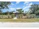 Charming single-story home with a metal roof and well-maintained front yard at 6118 Kracker Ave, Gibsonton, FL 33534