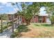 Welcoming red brick home featuring a convenient ramp and a well-manicured front lawn at 6118 Kracker Ave, Gibsonton, FL 33534