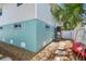 This backyard has a stepping stone path and a tropical vibe at 616 2Nd St, Indian Rocks Beach, FL 33785
