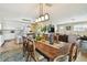Dining area with a wooden table open to the kitchen and living room at 616 2Nd St, Indian Rocks Beach, FL 33785