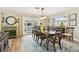 Elegant dining room with a wooden table and access to the outdoor patio at 616 2Nd St, Indian Rocks Beach, FL 33785