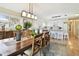 Well-lit dining room with view of the kitchen and an outdoor patio at 616 2Nd St, Indian Rocks Beach, FL 33785