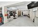 Open garage features ample space for storage, along with workbench and utility equipment at 616 2Nd St, Indian Rocks Beach, FL 33785