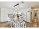Modern kitchen with granite countertops, white cabinets, and a central island at 616 2Nd St, Indian Rocks Beach, FL 33785