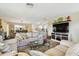 Open-concept living room with access to the dining area and kitchen at 616 2Nd St, Indian Rocks Beach, FL 33785