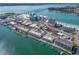 Expansive aerial view of waterfront condo community with boat docks and proximity to the beach and the Gulf at 640 Bayway Blvd # 302, Clearwater Beach, FL 33767