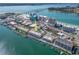 Expansive aerial view of waterfront condo community with boat docks and proximity to the beach and the Gulf at 640 Bayway Blvd # 302, Clearwater Beach, FL 33767