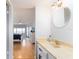 Bathroom featuring a white vanity with a view of the primary bedroom at 640 Bayway Blvd # 302, Clearwater Beach, FL 33767